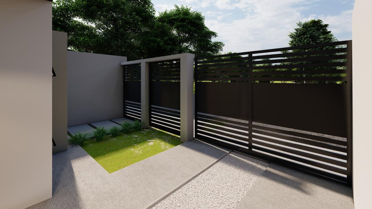 Portón metálico y muro perimetral con detalles en herrería oscura y jardín